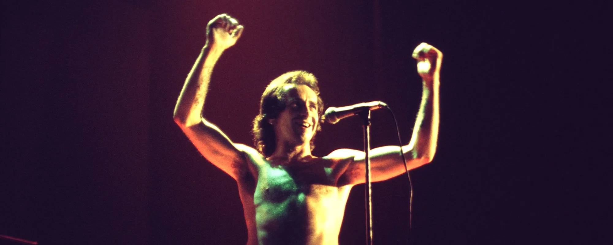 AMERICAN SONGWRITER: Bon Scott Estate Celebrates Late AC/DC Frontman’s 78th Birthday with Tribute Concert, New Merchandise
