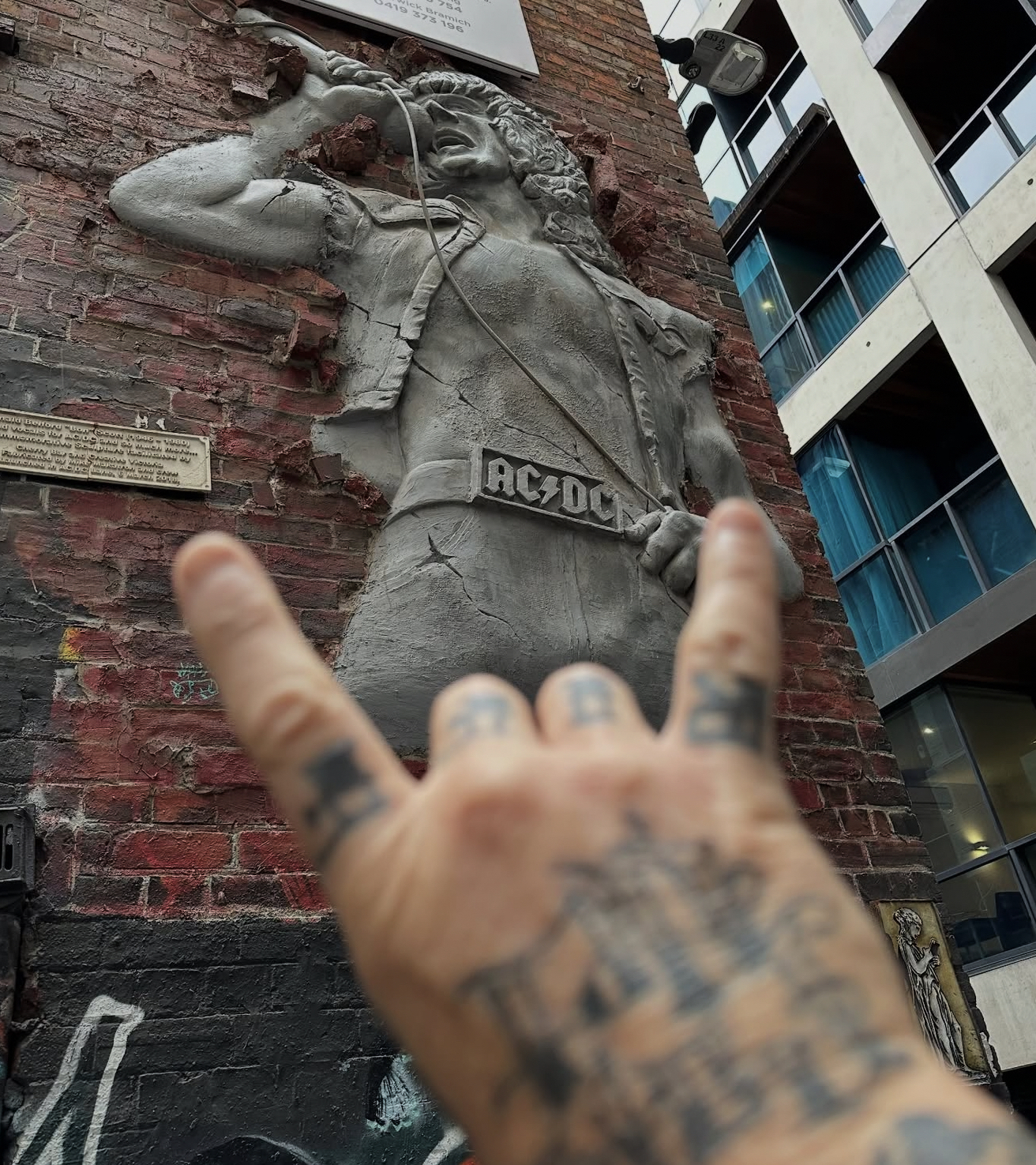BLUNT: James Hetfield Visits Cliff Burton Mural and Bon Scott Tribute Ahead of Metallica’s Melbourne Show